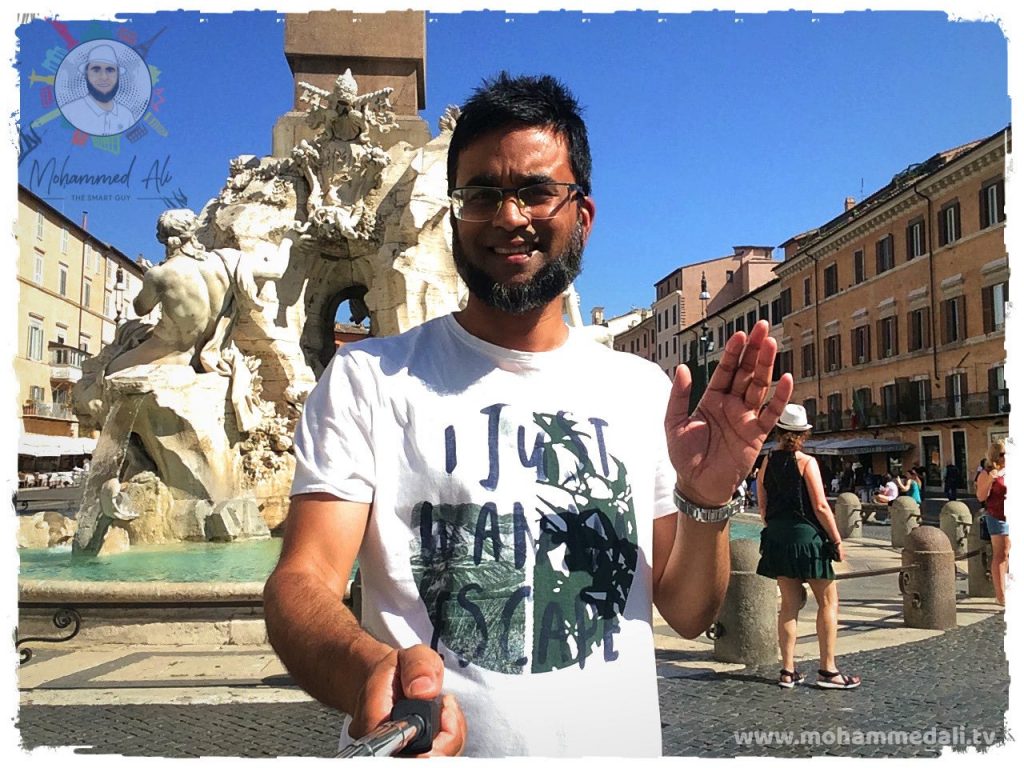 Standing with excitement in front of a fountain in Piazza Novana