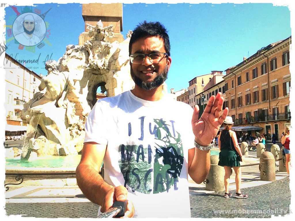 Standing in front of Fontana dei Quattro Fiumi of Piazza Navona