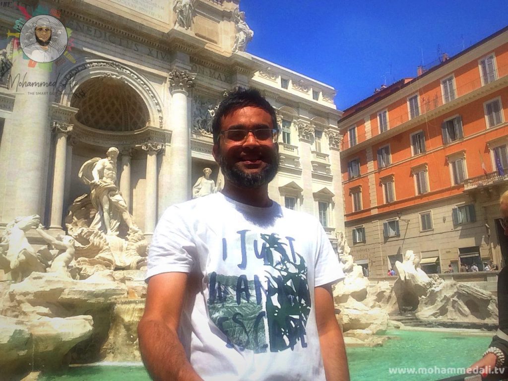 Standing in front of the famous Trevi Fountain in Rome, Italy