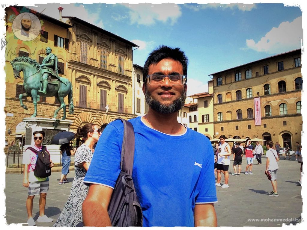 Standing happily on Piazza della Signoria in Florence